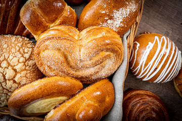 Fresh pastries buns wicker basket rustic style bakery