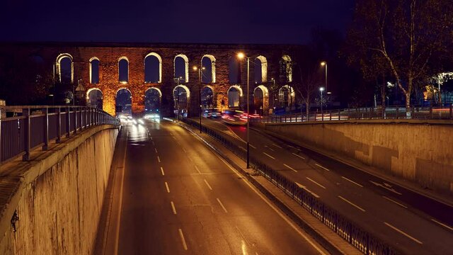 Time lapse clip near Valens Aqueduct (Bozdogan Su Kemeri) in evening with traffic of cars, Istanbul, Turkey. It was a water-providing system of the Eastern Roman capital Constantinpole