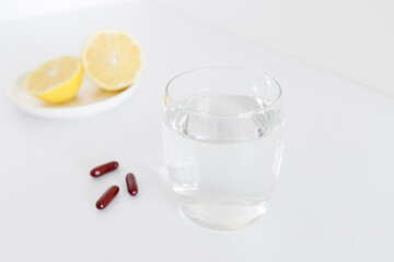 Glass of water with pills