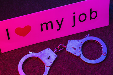 Label with text and handcuffs on the table. Concept on the topic of corruption