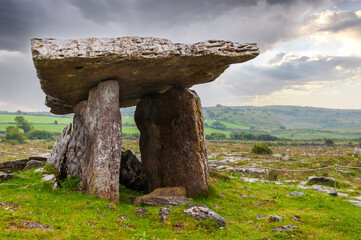 Poulnabrone dolmen, a neolithic portal tomb and a famous tourist attraction in the Burren, County Clare, Ireland - Europe