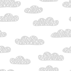 Vector seamless pattern with hand drawn clouds. Simple design for textile, wrapping paper