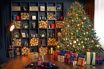 Naklejka na ściany i meble Christmas interior with bookshelves, christmas tree, boxes, chair in studio.