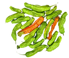 Green and orange drying chili peppers, natural organic with wrinkled skins. Isolated on white. Dragon Roll Shishito