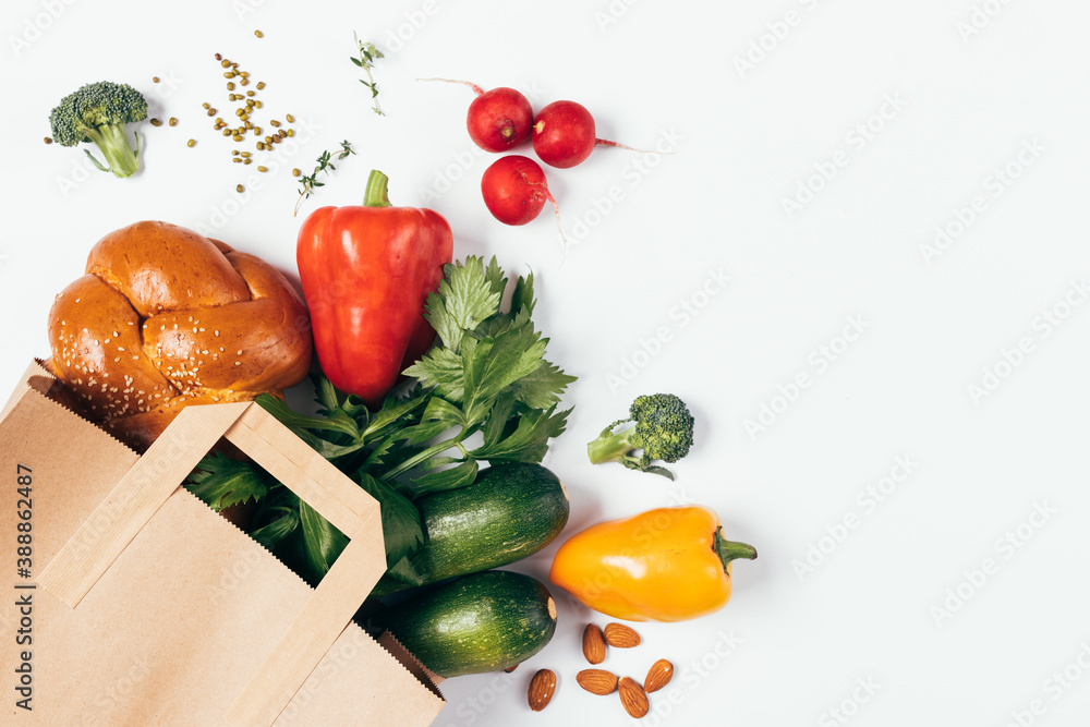 Wall mural top view paper shopping bag full of healthy food