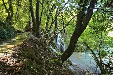 Fototapeta premium Skra Waterfall in Greece shot from the path heading to the swim entry