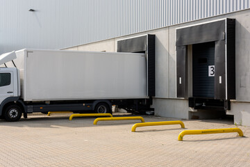 truck at loading ramps of a warehouse