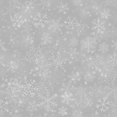 Christmas seamless pattern of snowflakes of different shapes, sizes and transparency, on gray background