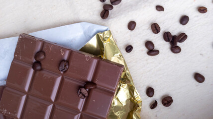 Photo of chocolate bar, coffee beans