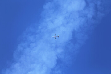 A plane flying in the sky very high