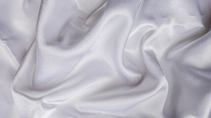 Obraz premium Photo white satin draped. View from above. Shining expensive fabric. Abstract background. For wedding and luxury content. Lifestyle.
