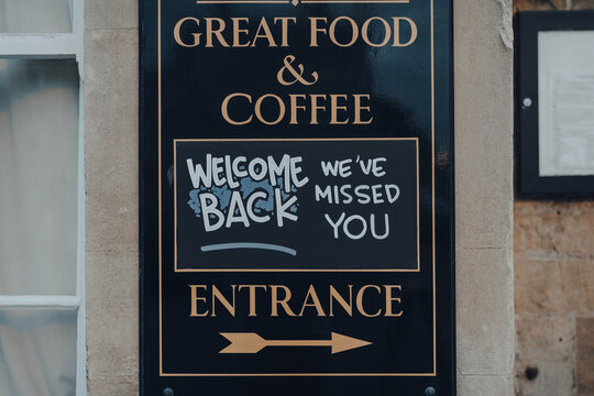 Great Food And Welcome Back Signs Outside English Pub In Cotswolds, UK.