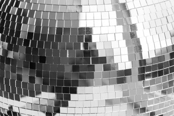 The surface of the mirror disco ball. Shiny mirror particles. The concept of club life, party and...