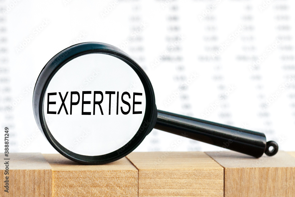 Poster look closely and expertise with a magnifying glass, business concept image with soft focus backgroun