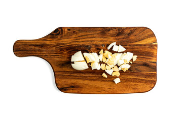 Diced Cooked Egg on Wooden Cutting Board Isolated Top View