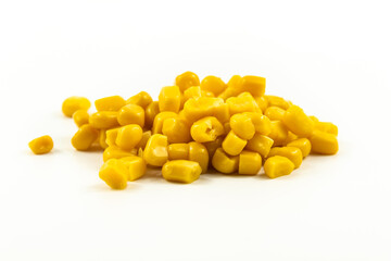 Handful of canned corn on white isolated background