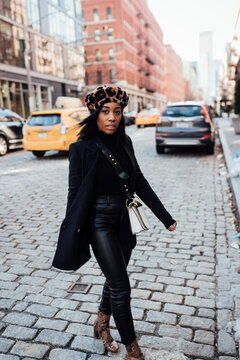 Woman wearing all black walking in New York City