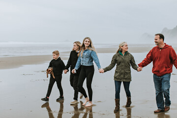 Family Walking on Beach Together