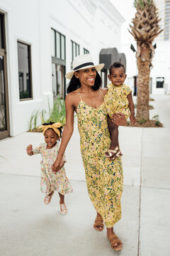 Mom and daughter wearing matching floral dresses
