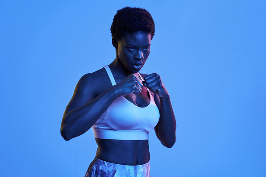 Black fighter looking to one side