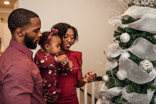 Family Decorating Christmas Tree