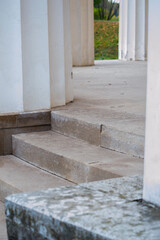View of the autumn Park through the frame of old columns
