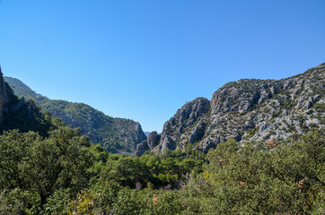 Fototapeta na wymiar Panoramic view to the rocky mountain range on the Lycian Way, famous tourist pathway in Turkey