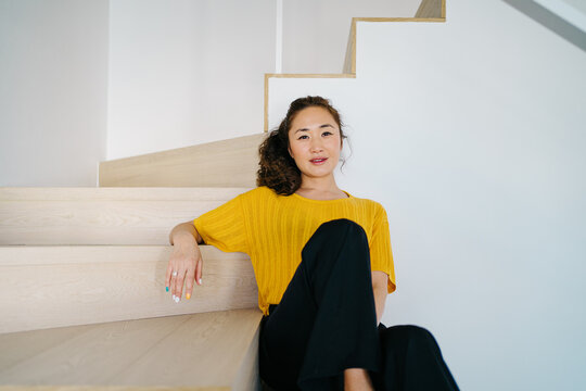 Stylish Asian Lady Sitting On Steps