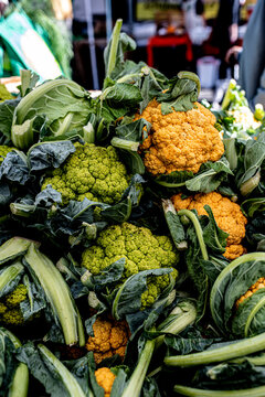 Green and orange broccoli at a local farmers market