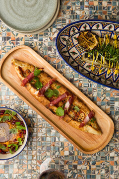 Turkish style pizza, grilled fish and sweet potato hummus.