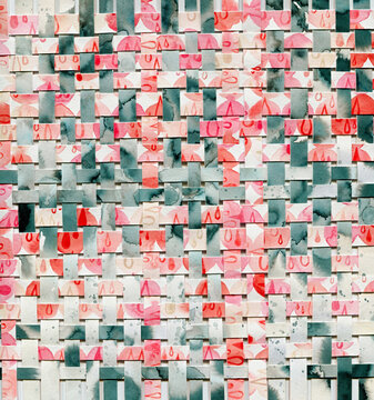Paper weaving collage with red drops