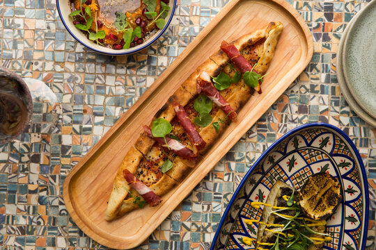 Turkish style pizza, grilled fish and sweet potato hummus.