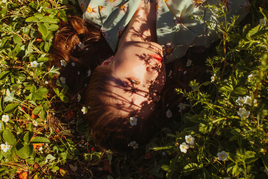 Young woman resting on grass