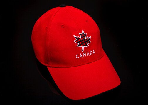 Pleasant Valley, Canada - March 10, 2017: Red Ball Cap  With Canadian Maple Leaf On Black.