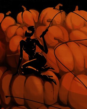 Halloween. A woman in a Halloween outfit sits on a large pile of pumpkins.