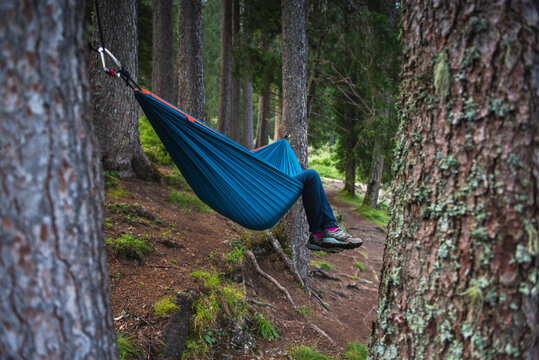 Person laying in the hammock with only legs visible