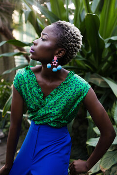 Beautiful black woman with glossy makeup. Stylish young african american teenage girl posing in fashion clothes.