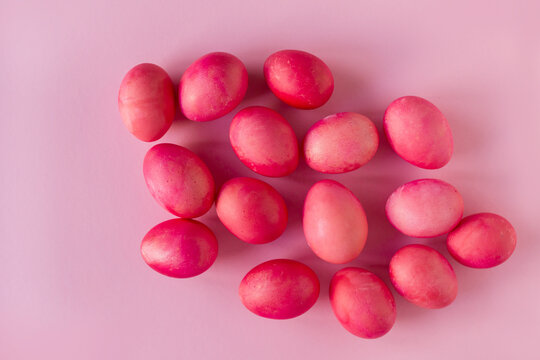 Pink Easter eggs on pink background.