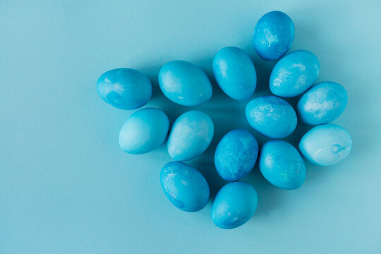 Blue Easter eggs on blue background. Copyspace. Still life photo of lots of blue easter eggs.Background with easter eggs. Easter photo concept