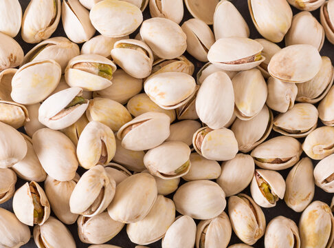 Background of pistachios closeup. The nuts