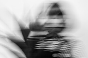 artistic black and white portrait of woman with motion blur