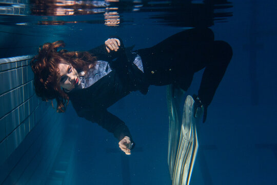 underwater portrait of business woman wearing fins