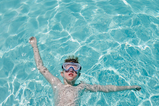 Child floating in a Pool