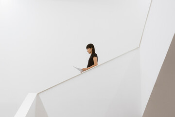 a business woman walking on the stairs