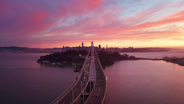 San Francisco Oakland Bay Bridge Aerial Cityscape Flythrough with Colorful Sunset