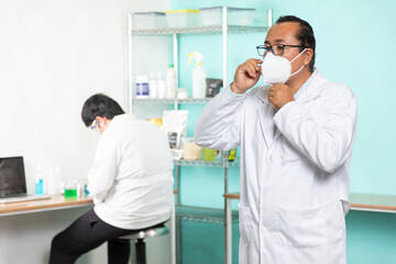 Proud enterprising man in his lab