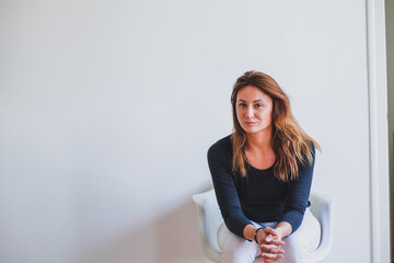 portrait of middle-aged caucasian woman at home with copy space