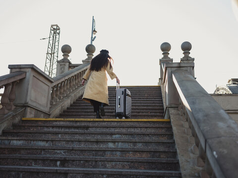 Traveler going up to train station