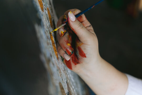 Girl painting on canvas