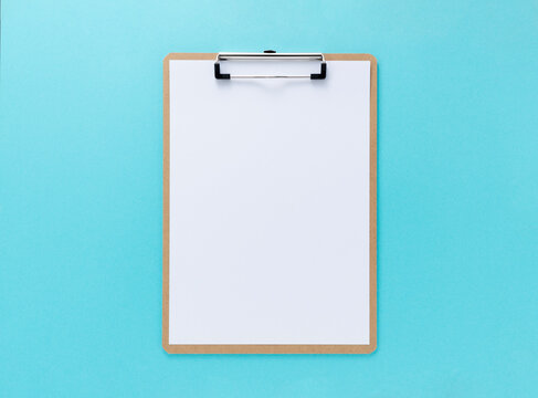 A clipboard with white paper on a blue background